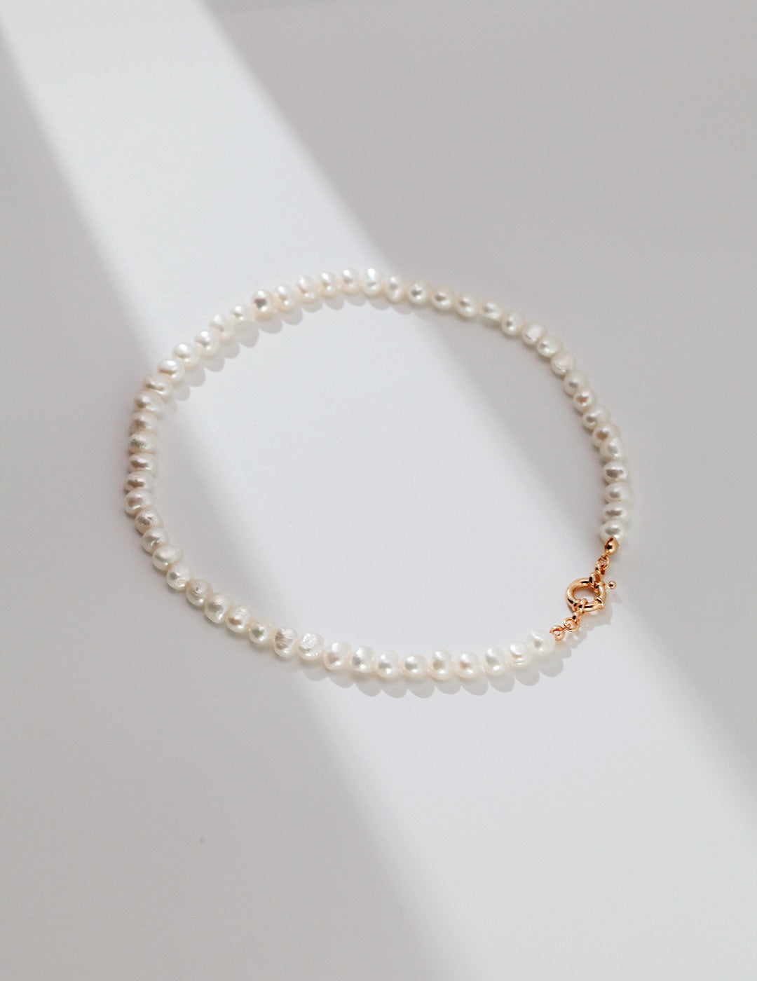 Elegant Single Strand of Baroque Pearls with Golden Clasp