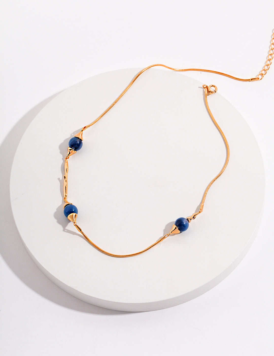 Elegant Blue Sphere Necklace with Fluid Accents