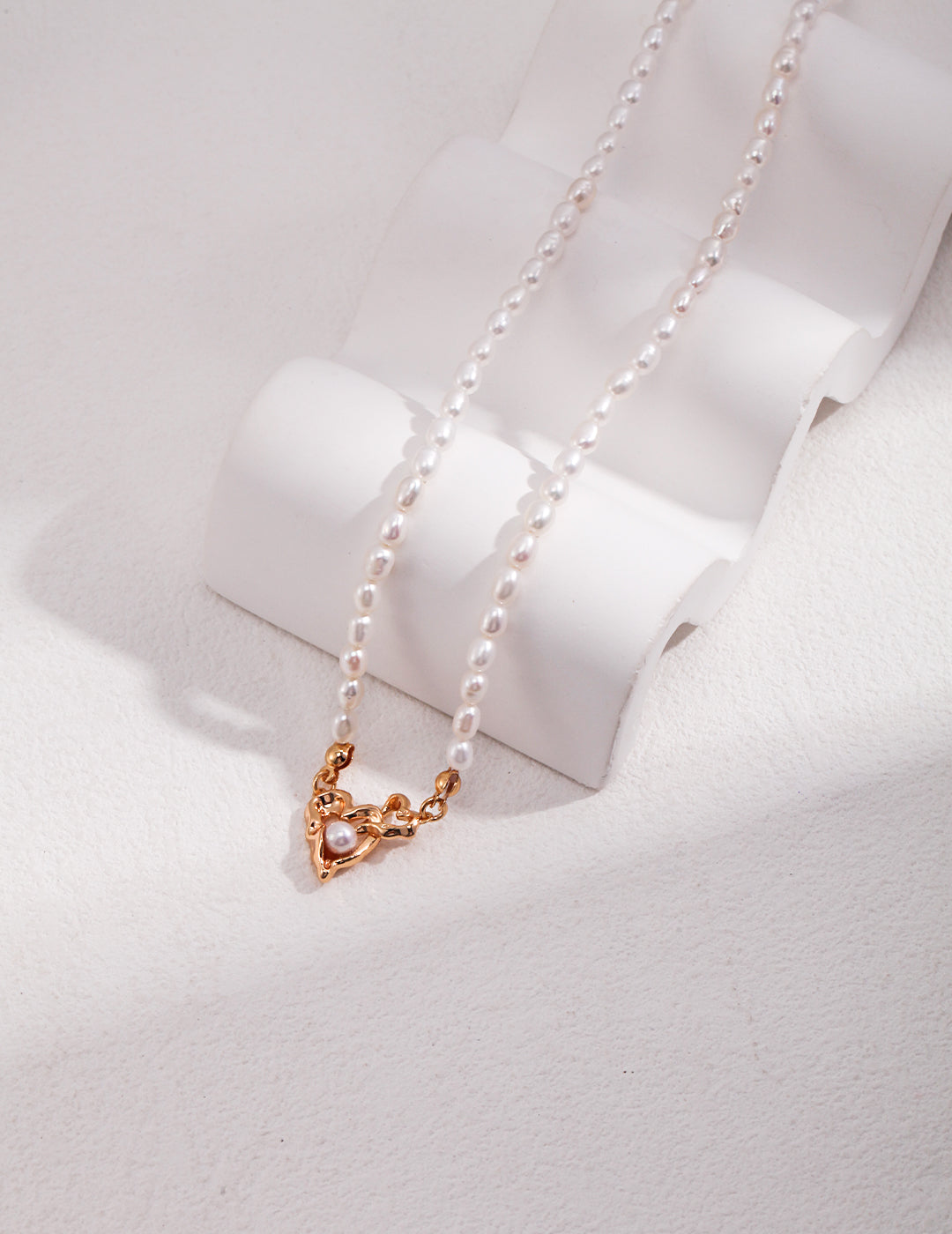 Intertwined Hollowed Hearts with Floating Pearl Pendant Necklace