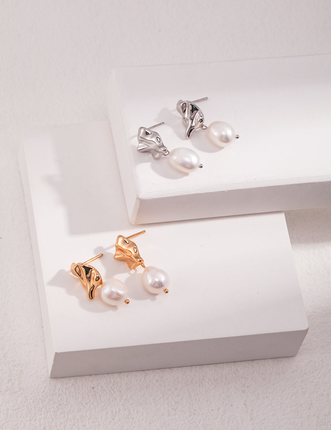 Irregular shell style earrings with pearl dangle