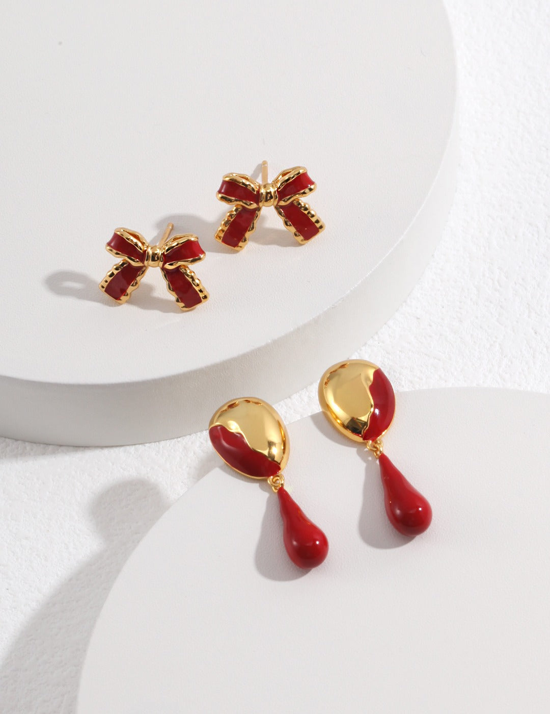 collection of baroque style earrings with red drip glaze