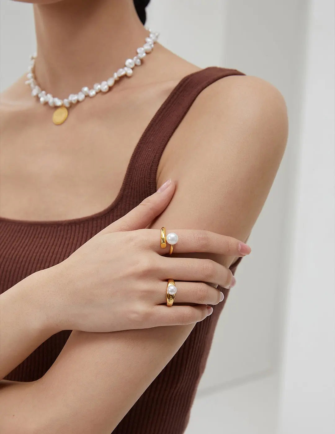 Lady wearing single freshwater pearl S925 silver coated 18k gold vermeil open end ring