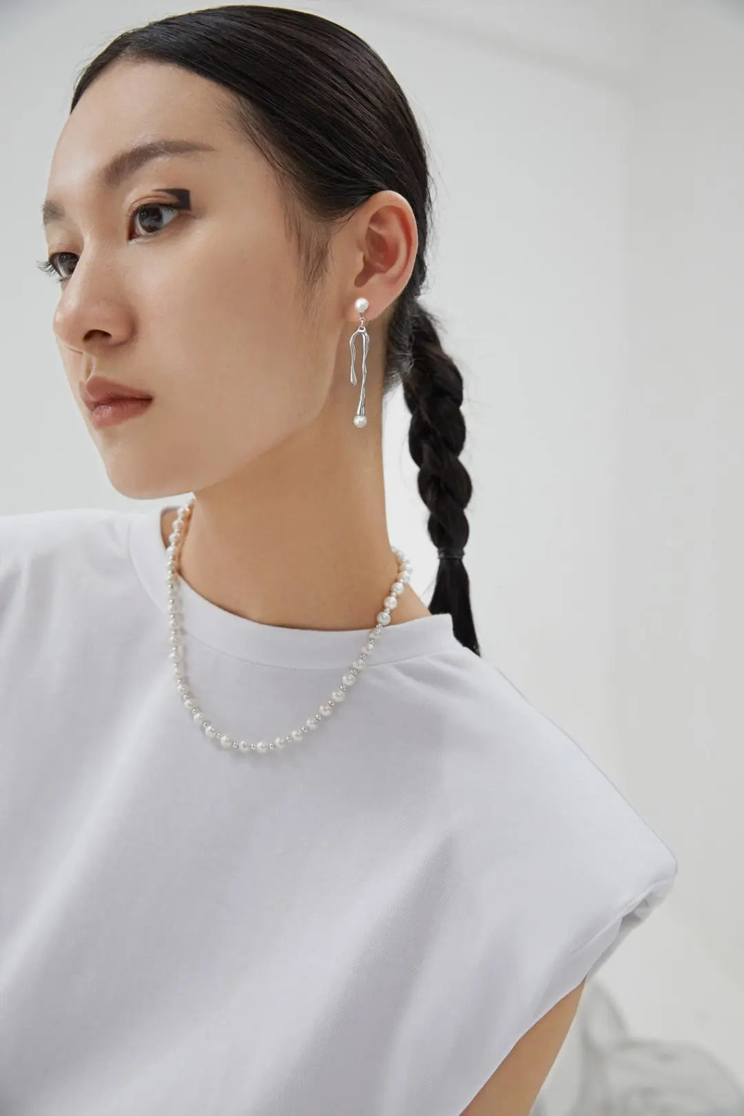 Lady wearing jellyfish ocean design S925 silver earring with freshwater pearl and droplets