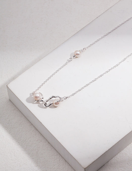 Elegant Pearl Necklace with Infinity Shaped Vine-Like Pendant