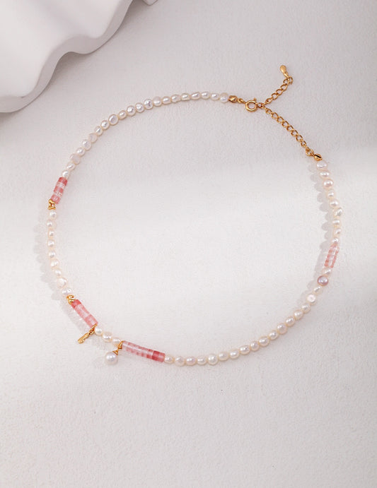 Pearl choker with pink gemstone