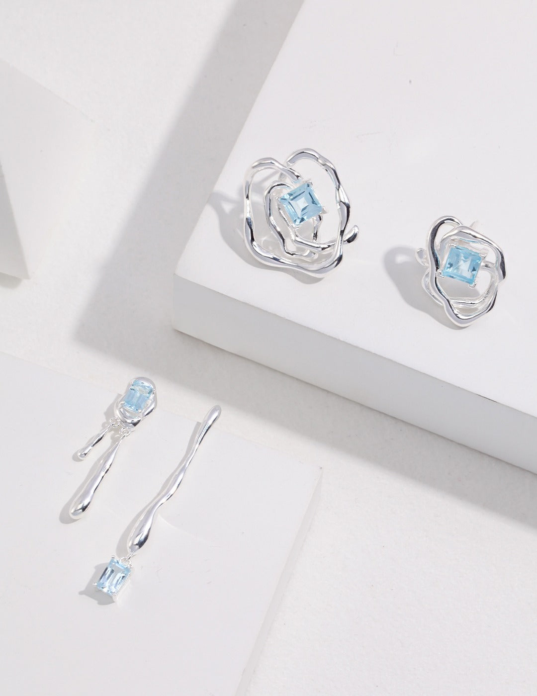 Baroque style earrings with baby blue gemstone