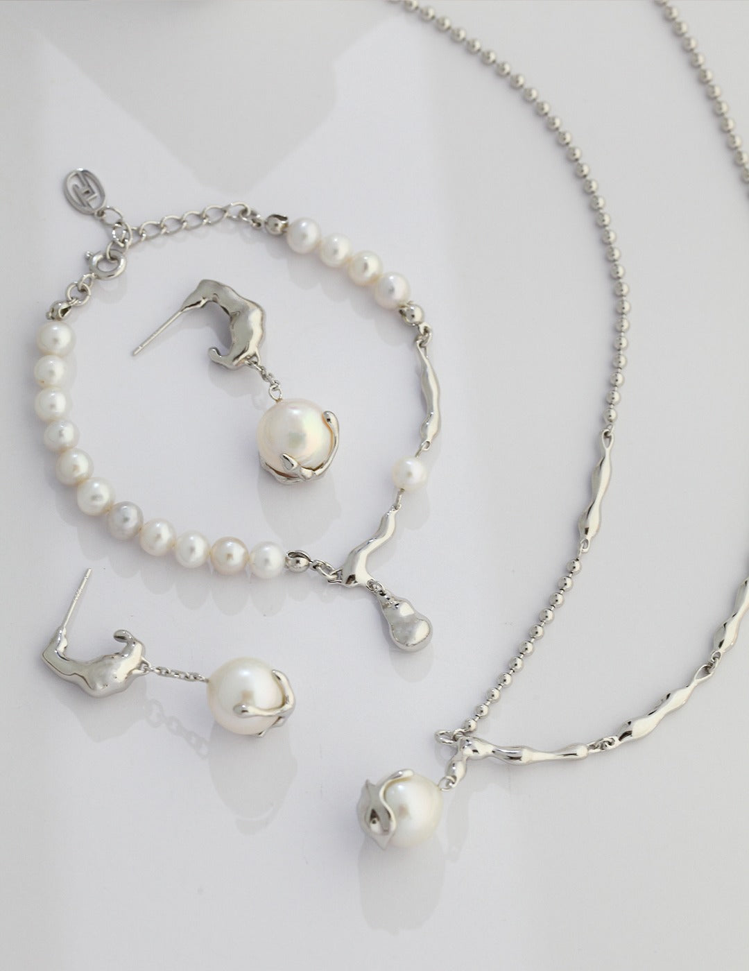 Minimalist single pearl dangle earrings in silver